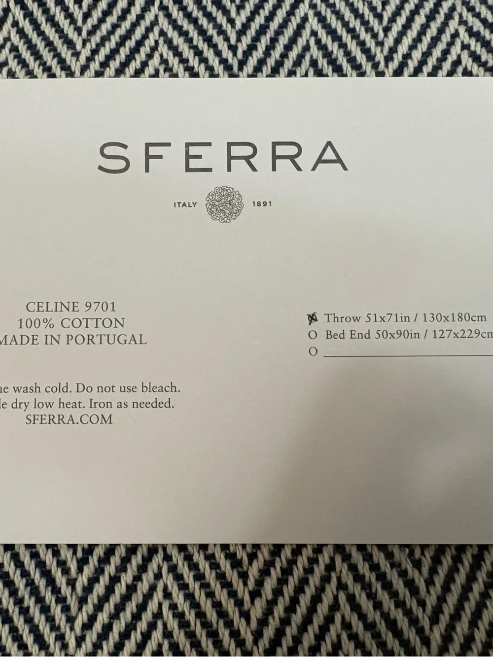 SFERRA “Celine” Navy and Cream Herringbone Throw. NWT. 51x71in. 100% cotton.